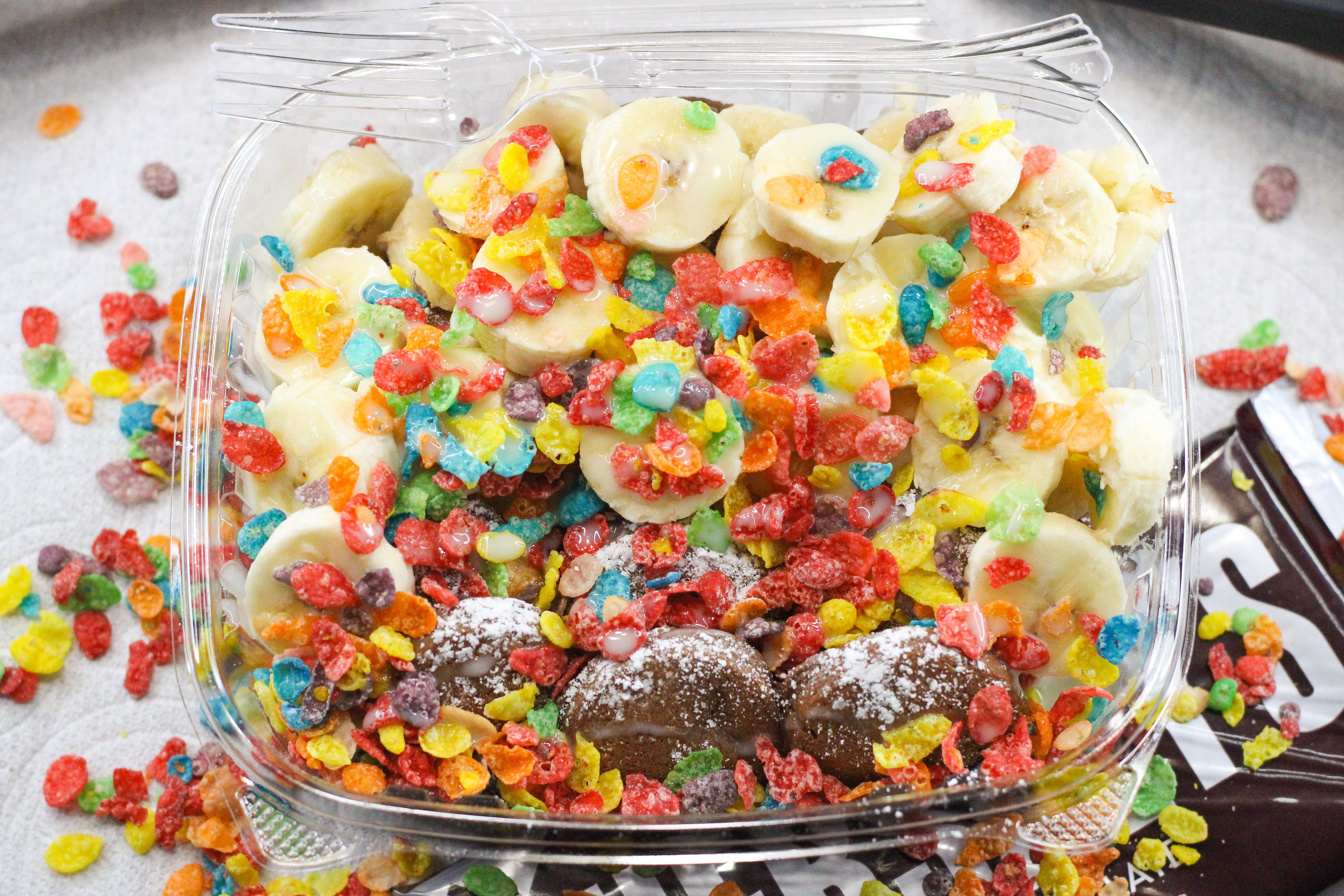 Chocolate pancakes with fruity pebbles, banana, and lechera